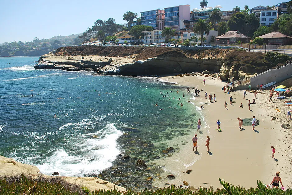 The sheltered beach and sandstone cliffs of La Jolla Cove, a top San Diego snorkeling spot